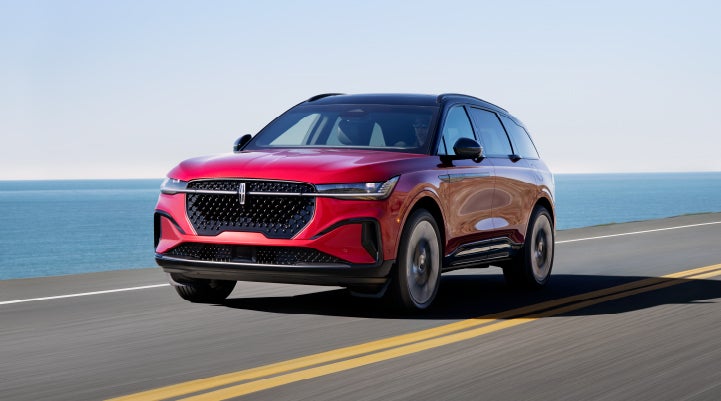 A 2024 Lincoln Nautilus® SUV is being driven on a seaside roadway. | Napleton River Oaks Lincoln in Calumet City IL