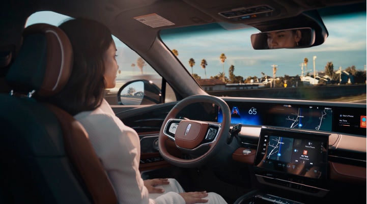 A person is shown driving hands-free on the highway with available Lincoln BlueCruise technology. | Napleton River Oaks Lincoln in Calumet City IL