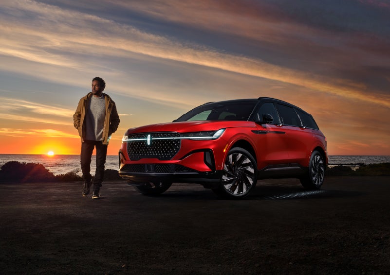 A person is shown next to a 2024 Lincoln Nautilus® SUV as the Lincoln Embrace sequence takes place. | Napleton River Oaks Lincoln in Calumet City IL