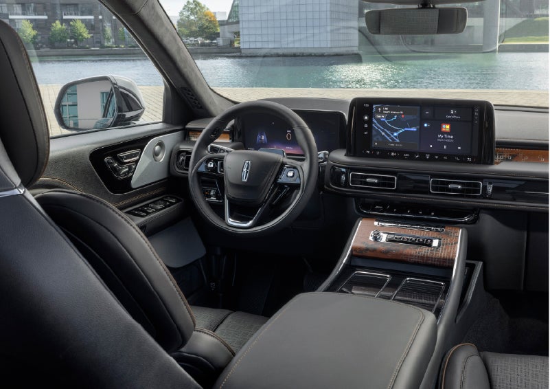 The interior of the 2026 Lincoln Aviator® SUV is shown parked with a view of a harbor through the windshield. | Napleton River Oaks Lincoln in Calumet City IL