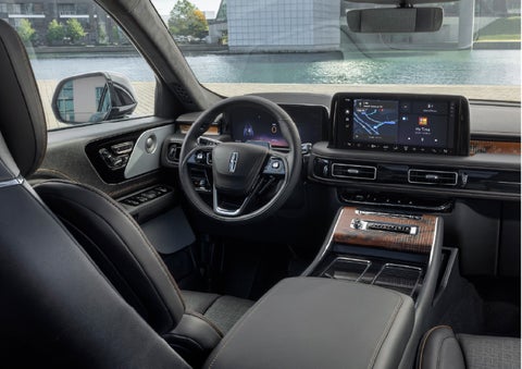 The interior of the 2026 Lincoln Aviator® SUV is shown parked with a view of a harbor through the windshield. | Napleton River Oaks Lincoln in Calumet City IL