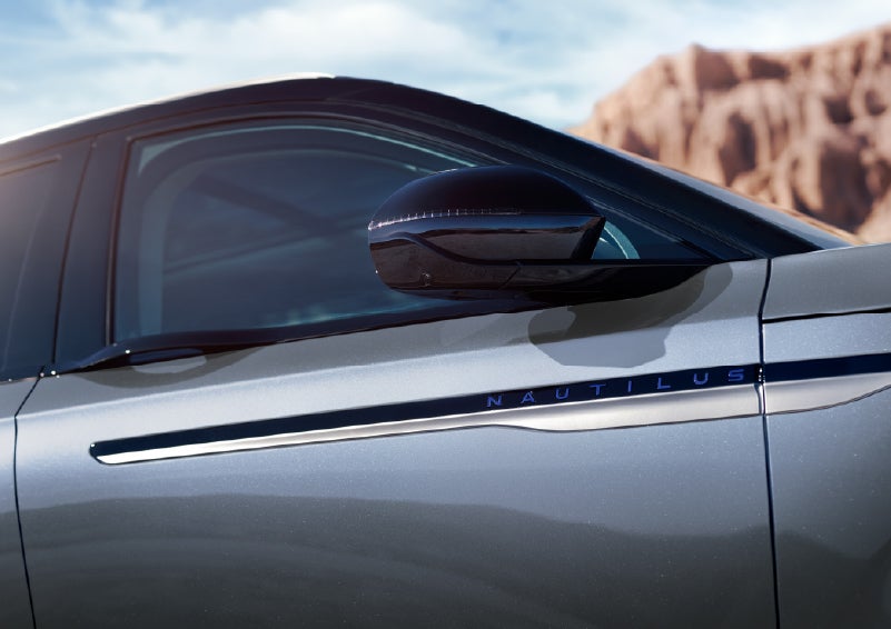 Blue lettering on the side of the vehicle that reads Nautilus indicates the available Hybrid Powertrain. | Napleton River Oaks Lincoln in Calumet City IL