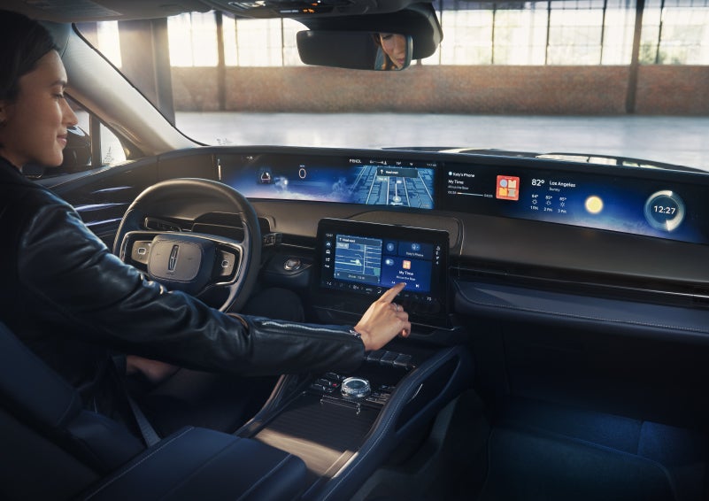 The driver of a 2026 Lincoln Nautilus® SUV interacts with the center touchscreen. | Napleton River Oaks Lincoln in Calumet City IL
