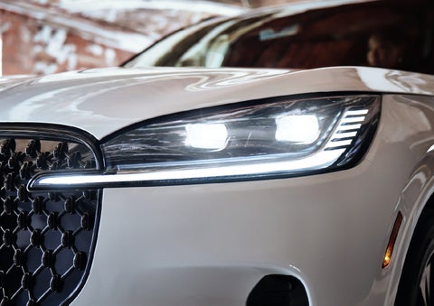 A close-up of a headlamp on the 2027 Lincoln Aviator® SUV is shown. | Napleton River Oaks Lincoln in Calumet City IL