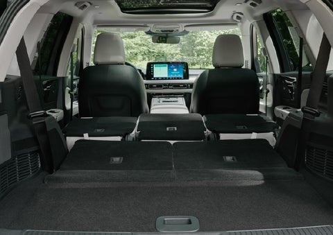 A rear to front view of the interior of a 2027 Lincoln Aviator® Black Label™ SUV shows the third and second rows folded flat | Napleton River Oaks Lincoln in Calumet City IL